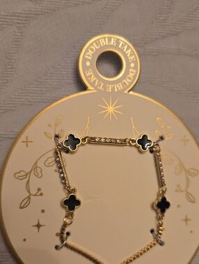 Gold Tone Necklace Featuring Enamal Clovers